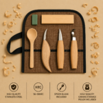 Wood carving tool set in a brown roll with five wooden-handled tools and a green sharpening block on a tan background, with wood shavings around.