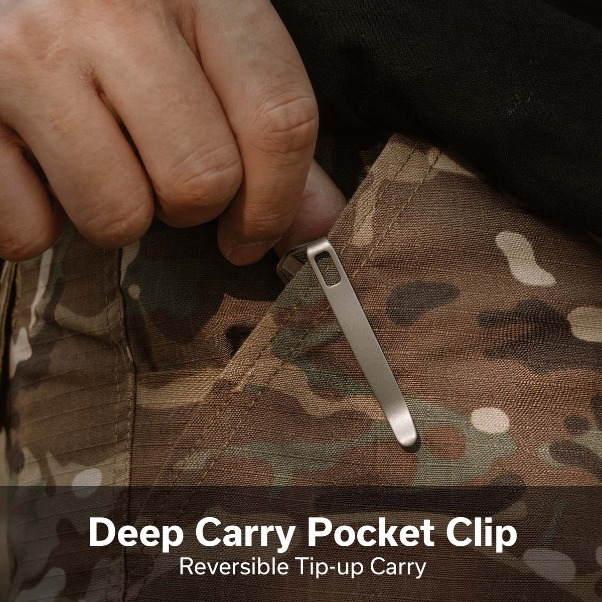 Metal deep-carry pocket clip being attached to camouflage fabric; reversible tip-up carry feature shown.