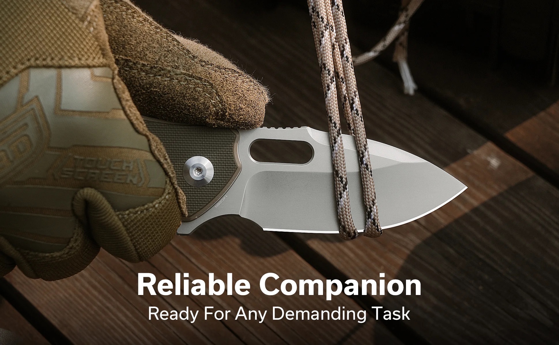 Close-up of a tactical knife with braided paracord and a rugged boot or strap, set on a wooden surface to suggest readiness for demanding tasks.