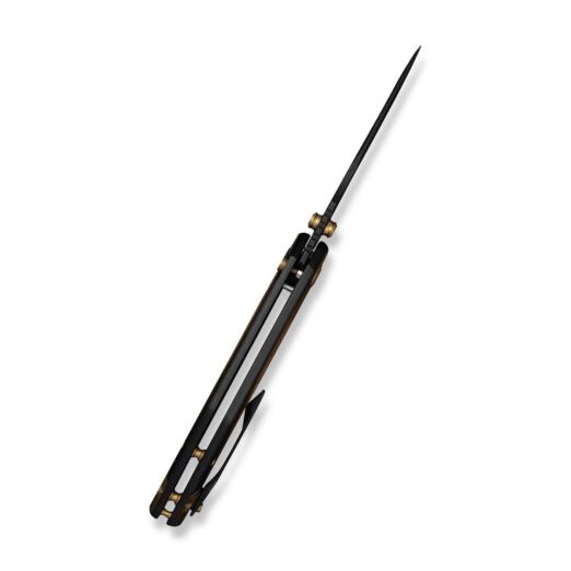 Folding knife with a long, narrow blade extended from a dark handle, photographed diagonally.