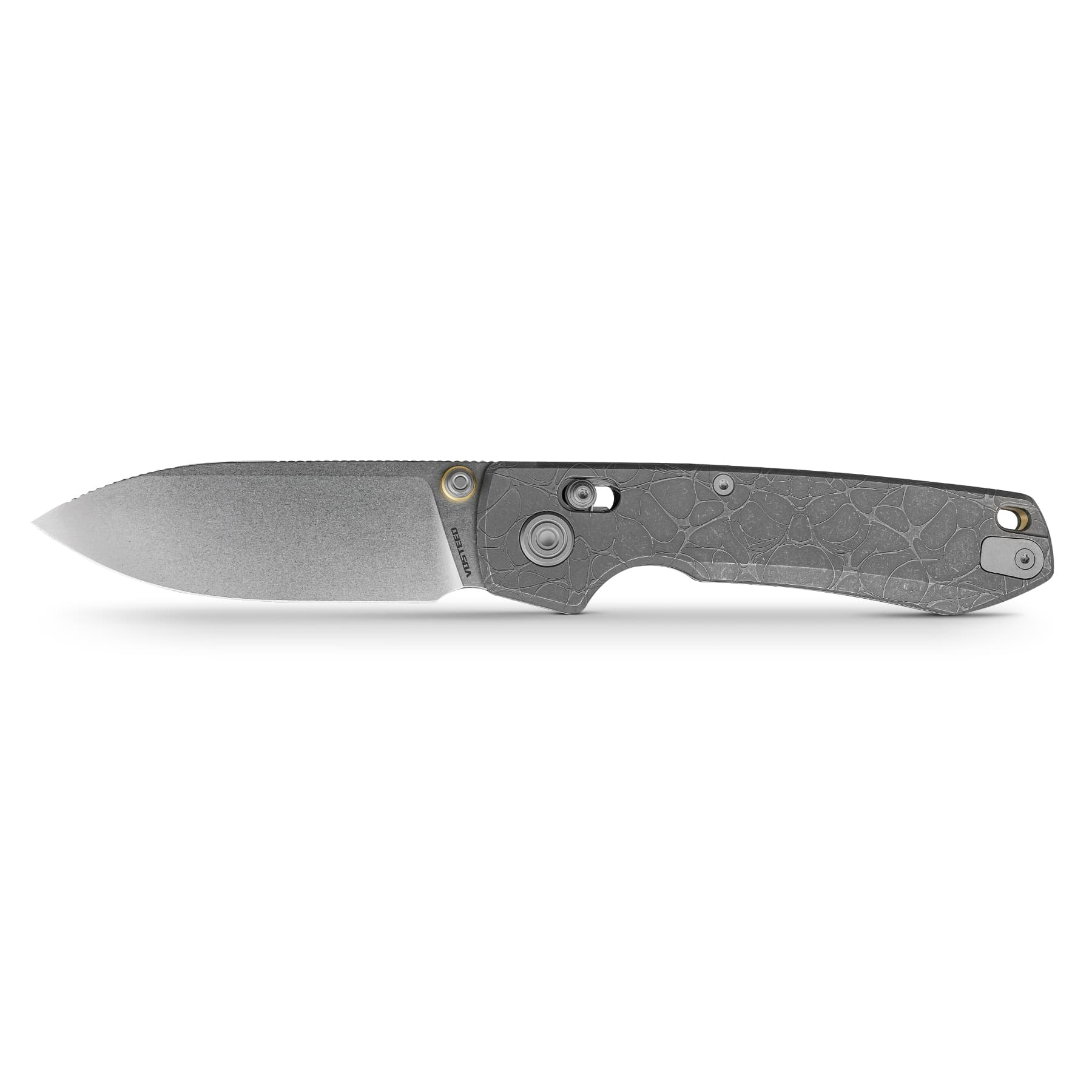 Folding knife partially visible along the bottom edge with a textured gray handle and blade point extending leftward against a white background.
