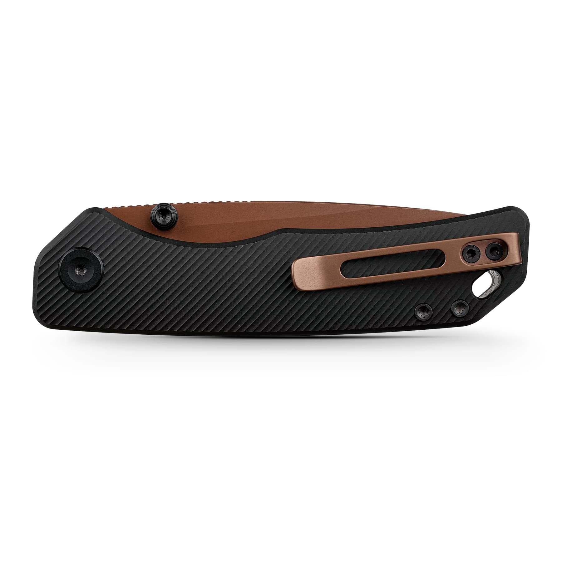 Close-up of a folding knife handle with a black ribbed grip and copper-colored frame.