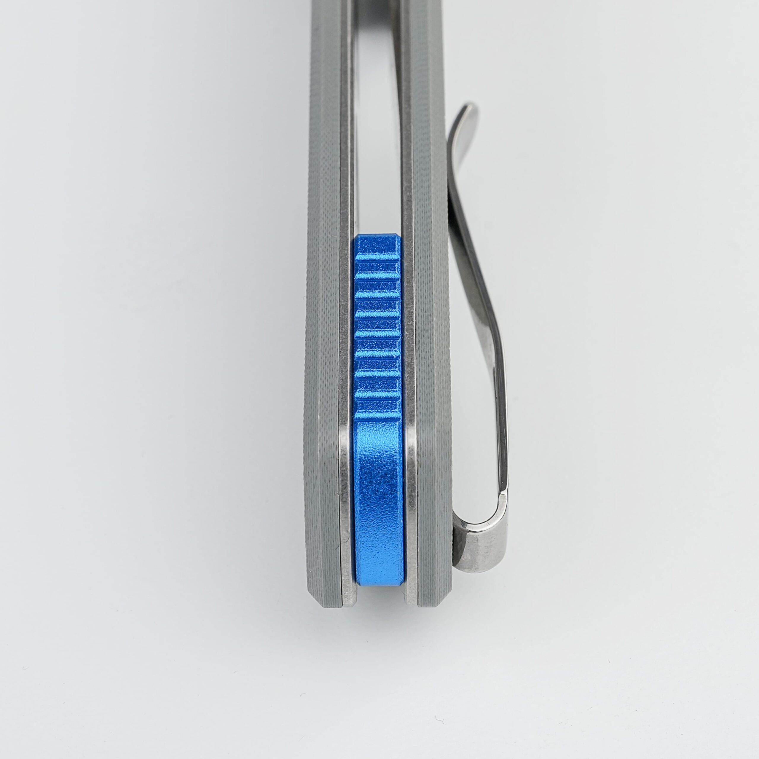 Side view of a gray metal frame with a blue knurled adjustment block sliding along a rail, and a curved metal loop on the right.