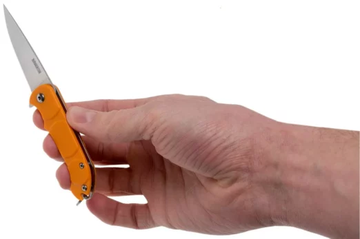 Person's hand grips an orange folding knife with the blade extended outward